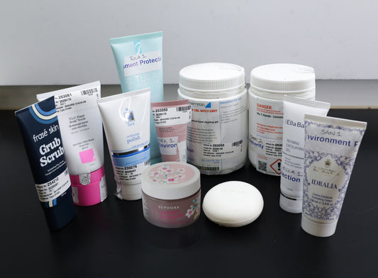 Assortment of skincare and exfoliating products displayed together, including scrubs and gels identified in the NSW EPA investigation into prohibited plastic microbeads.